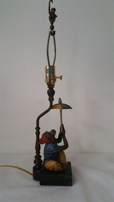 The phrase cold enough to freeze the balls off (or on) a brass monkey is a colloquial expression used by some english speakers. Vintage Antique Monkey in Red Hat Umbrella Cold Painted Bronze Brass Table Lamp… | Vintage table ...
