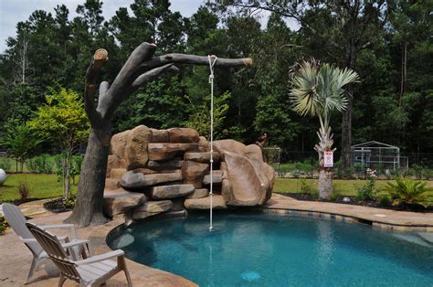 Waterfall With Slide And Rope Swing Made From Concrete Tree Backyard