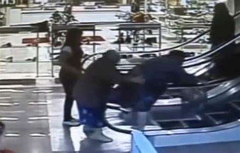 Video Shows A Woman Straddling An Escalator Rail And Being Pulled