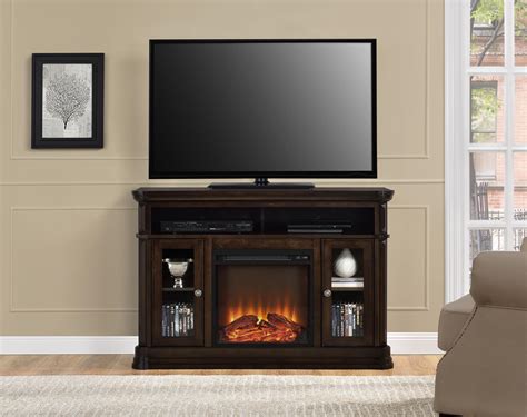Capable of holding tvs up to 70 inches, this is a console that stands out with its compact size and still offering a decent amount of storage space, this tv stand and electric fireplace unit is definitely worth the money. Dorel Home Furnishings Brooklyn Fireplace TV Stand