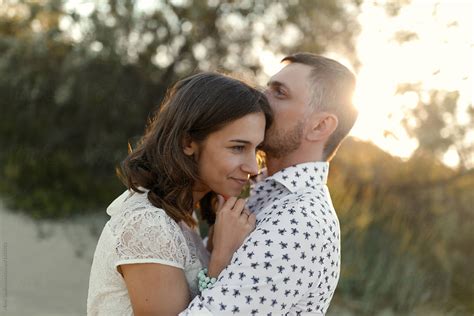 Couple Embracing In Sunset By Stocksy Contributor Milles Studio