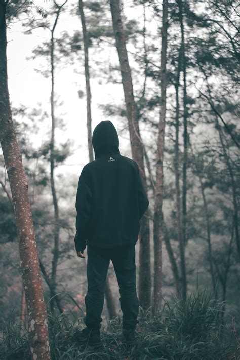 Free Photo Man Wearing Black Hoodie With Black Pants Standing In The Middle Of Forest Adult