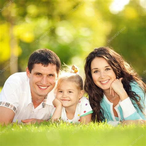 Happy Mother Father And Daughter In The Park Stock Photo Suravid