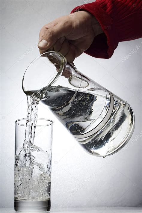Hand Pouring Water — Stock Photo © Milosluz 5753014