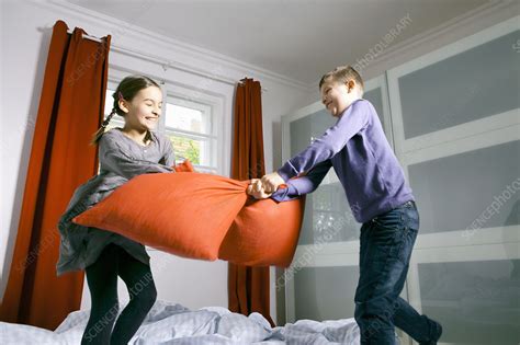 Children Having Pillow Fight On Bed Stock Image F0058453 Science