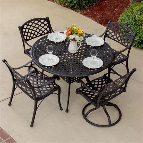 Heritage Piece Cast Aluminum Patio Dining Set With Swivel Rockers And Round Table By