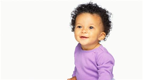 Smiley Curly Hair Baby Boy Is Wearing Purple Dress In