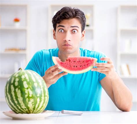 Man Eating Watermelon At Home Stock Photo Image Of Excited Freshness