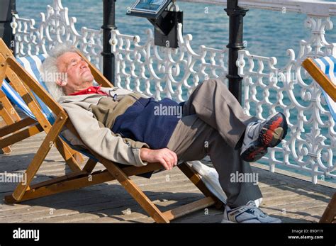 Elderly Man Person Gentleman Asleep Sleeping Sat On A Deckchair Stock
