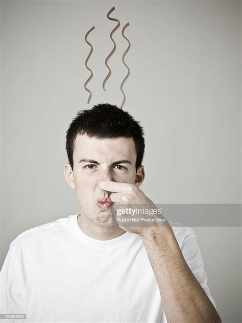 Man Smelling A Stinky Odor High Res Stock Photo Getty Images