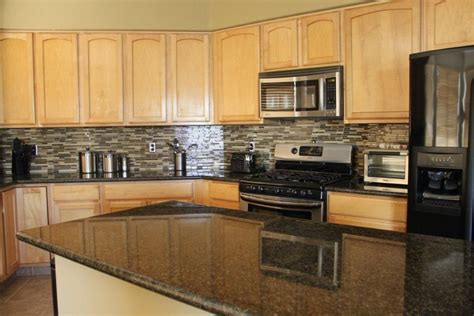 Uba tuba is a popular stone made up of a dark green base with gold veins running through it. Uba Tuba granite | Granite countertops, Uba tuba granite, Oak cabinets