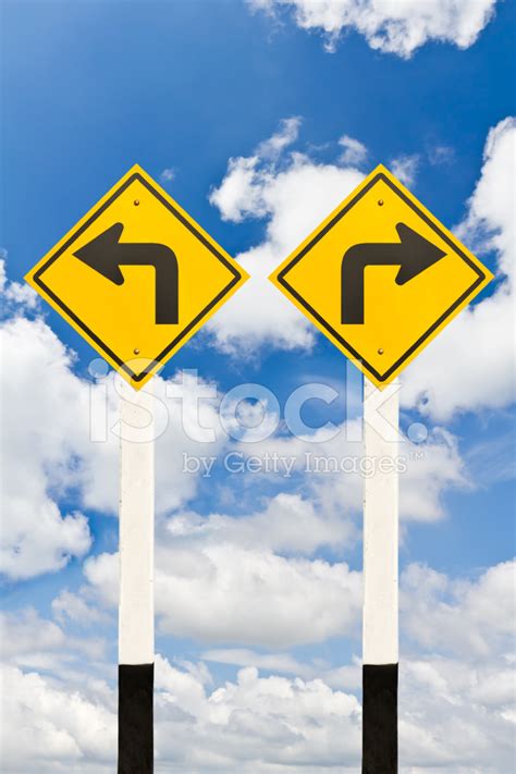 Left And Right Turn Road Signpost Stock Photos
