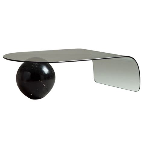 We carry millions of home products with free shipping from furniture and decor to lighting and renovation. A Bent Glass Coffee Table with Large Sphere Base at 1stdibs