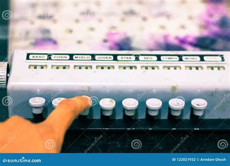 Technician Hands Pressing Buttons Of Side View Of Pathological Manual