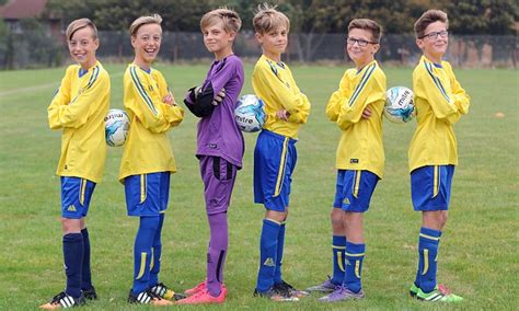 Youth Football Team With Three Sets Of Identical Brothers