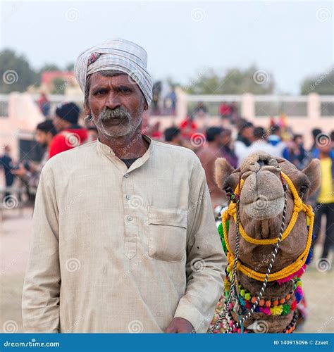 Rajasthani Man With His Beautiful Camel Poses For A Photo At Festival In Rajasthan State India