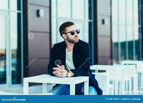 Man Wearing Sunglasses And Jeans Stock Image Image Of Casual Coat