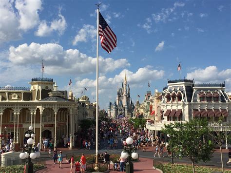 The American Flag Is Flying High In The Air At Disneys Grand Florie