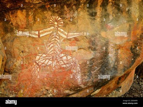 Ancient Aboriginal Painting Of Man Art On Huge Rock Stone In Kakadu