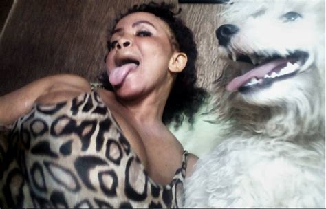 Photo Busty Cossy Orjiakor Cuddling Her Big White Dog