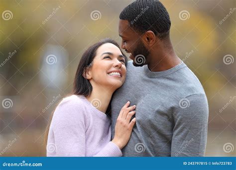 Happy Interracial Couple In Love Looking Each Other Stock Image Image Of Date Cuddling 243797815