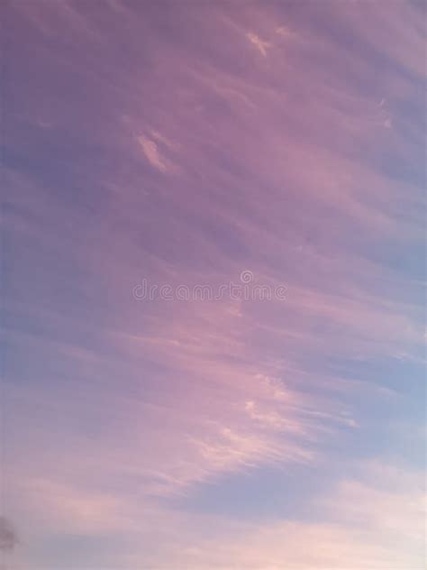 Pink Sky With Wispy Clouds And Blue Sky At Sunrise Stock Image Image