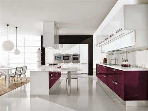 Gloss white + black glazed feature units. Modern white gloss kitchen units combined with other colors