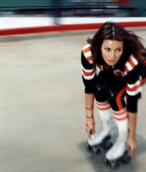 She is a lady dressed in a pink and black dress with a matching helmet. Raquel Welch | Raquel welch, Roller girl, Derby girl