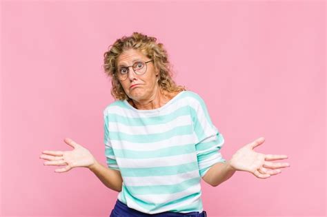 Premium Photo Middle Aged Woman Feeling Puzzled And Confused Unsure