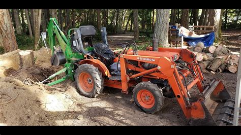 Kubota B7100 Digging Out A Tree Stump With A Bradco 3265 Backhoe Youtube