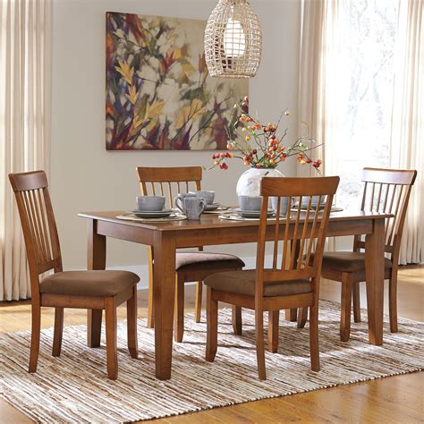 These ashley furniture dining chairs come with modern aesthetic appearances that can also blend well in hotels, restaurants and bars. Ashley Furniture Berringer 5-Piece 36x60 Table & Chair Set ...
