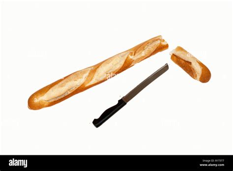 Baguette And Bread Knife With Breadcrumbs Stock Photo Alamy