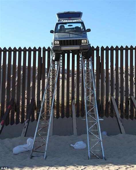 Jeep Gets Stuck On Fence Mexican Smugglers Fail Driving Up Makeshift