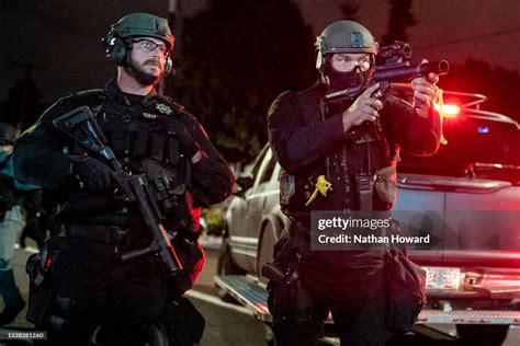 A Multnomah County Sheriffs Deputy Points A Less Lethal Weapon At News Photo Getty Images