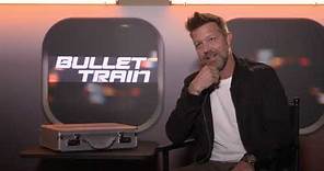 BULLET TRAIN David Leitch Interview - about stunts + cuts & bruisers + shooting a movie on a train
