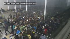 Hungarian Police Officers Appear to Throw Food At Crowd of Refugees in a Camp