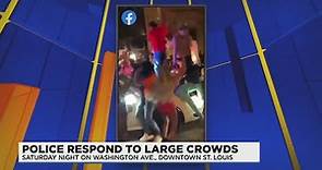 Videos show people dancing on top of St. Louis police car on Washington Avenue