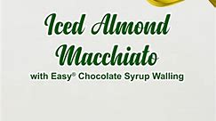 Quench your customer's thirst with tantalizing Iced Almond Macchiato with Easy® Chocolate Syrup Walling! Indulge in the creamy goodness of almonds, perfectly paired with a luxurious chocolate drizzle for an unbeatable flavor combination. 𝗜𝗡𝗚𝗥𝗘𝗗𝗜𝗘𝗡𝗧𝗦: Easy® Milk Essence (150g) Easy® Signature Almond Flavoured Syrup (3 pumps) Easy® Chocolate Syrup Easy® Coffee Espresso (2 pumps) Water Ice 𝗛𝗢𝗪 𝗧𝗢 𝗠𝗔𝗞𝗘 𝗟𝗜𝗤𝗨𝗜𝗗 𝗠𝗜𝗟𝗞 1. Combine 150g of Easy® Milk Essence and 1 liter of hot