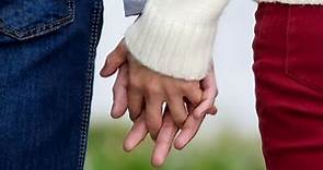 What It Means When You Hold Hands With INTERLOCKING FINGERS