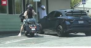 Megan Fox hops on the back of Machine Gun Kelly motorcycle