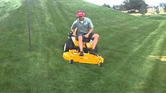 Walker zero-turn mower effortlessly mowing on 25 degree slope