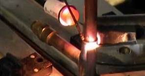 Resistance brazing compressor lines with American Beauty Resistance soldering equipment.
