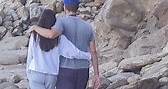 Dakota Johnson wraps her arms around boyfriend Chris Martin