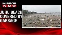 Mumbai Civic Body starts cleaning garbage washed ashore on Juhu beach