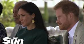 I watched as Meghan put on a brilliant acting performance as Harry stared daggers, royal expert says