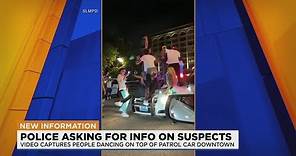 Videos show people dancing on top of St. Louis police car on Washington Avenue