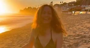 Leslie Mann, 51, rocks a tiny bikini and rolls around in the sand on beach trip