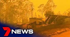 Day turns to night in Eden where bushfire evacuations continue | 7NEWS