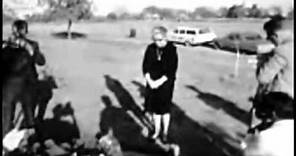 November 25, 1964 - Lee Harvey Oswald's mother Marguerite Oswald at his grave at Rose Hill Cemetery