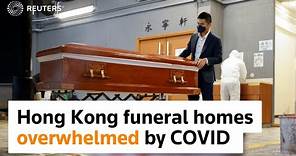 Hong Kong funeral parlors overwhelmed by COVID